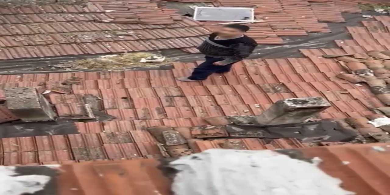 Çatıya saklanan firari, polisi izlerken yakalandı